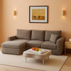 Brown corduroy 95-inch cloud modular sleeper sectional in a warm living room