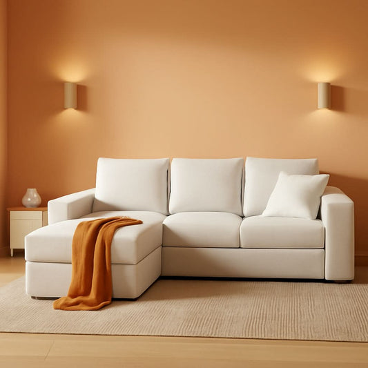 Beige velvet cloud modular sectional sofa with reversible chaise in a warm living room